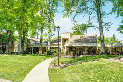 Exterior view of Greenhaven Place with landscaped gardens