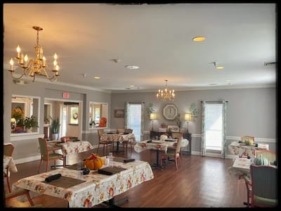 Dining room area with decorated tables and decor