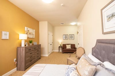 Cozy resident room with a bed and seating area