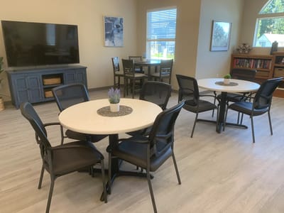 Bright common area with tables and chairs