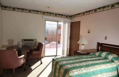 Private resident room with bed and seating area