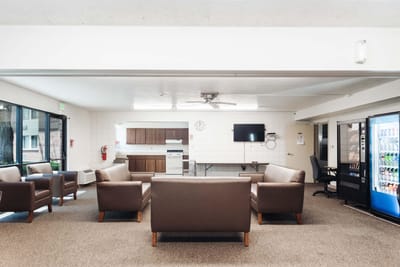 Bright common area with seating and amenities