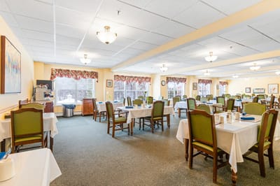 Dining room with tables set for residents