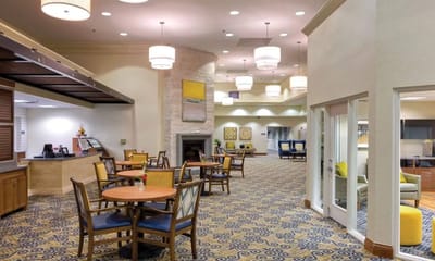Bright common area with seating and decor