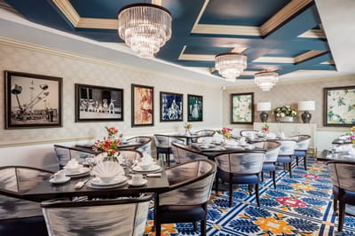 Elegant dining room set for a meal with floral arrangements