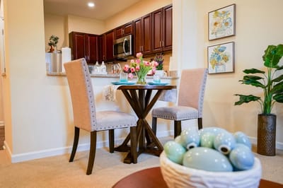Cozy dining area with modern decor and fresh flowers