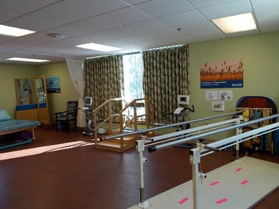 Rehabilitation room with equipment and sunlight
