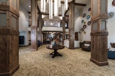 Bright interior common area with tall ceilings