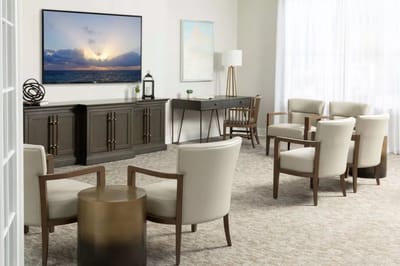 Bright common area with seating and a television