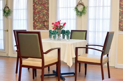 Interior dining area with a floral table setting