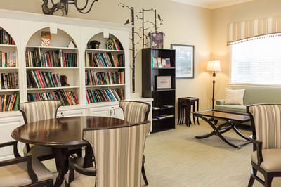 Interior common area with bookshelves and seating