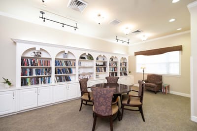 Interior common area with bookshelves and seating