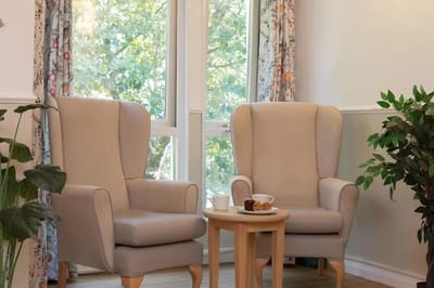 Cozy common area with comfortable armchairs and natural light