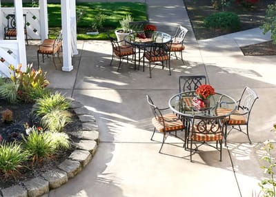 Outdoor seating area with tables and flowers