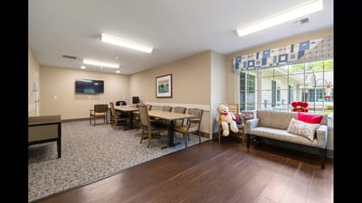Cozy common area with seating and game tables