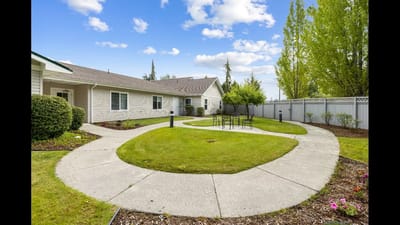 Well-maintained outdoor space with walking paths and seating
