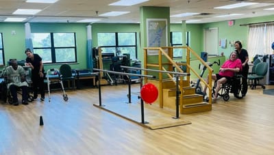Residents participating in a group activity in the common area