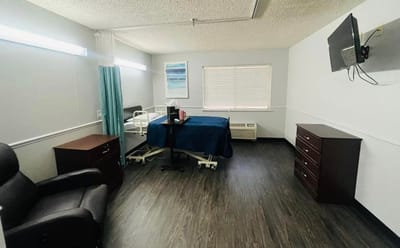 Private resident room with medical bed and furniture
