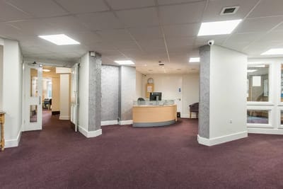 Interior view of a lobby area with reception desk
