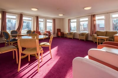 Bright common area with seating and windows