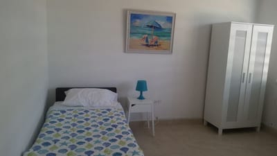 Cozy resident room with beach-themed decor