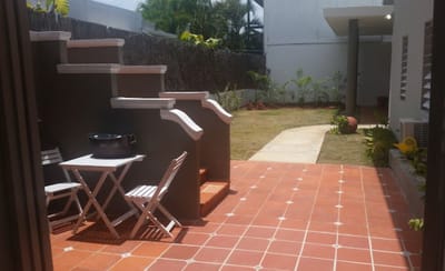 Outdoor patio area with seating and landscaping