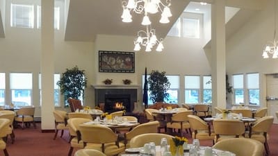 Bright dining room with tables set for meals