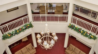 Interior view of a common area with seating and chandelier