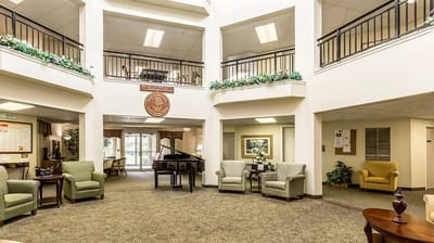Bright common area with seating and piano