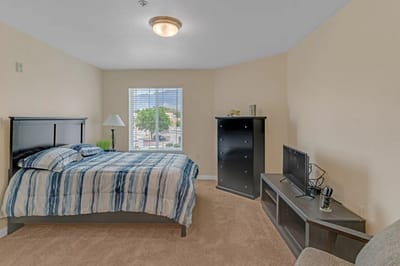 Cozy resident room with bed and TV