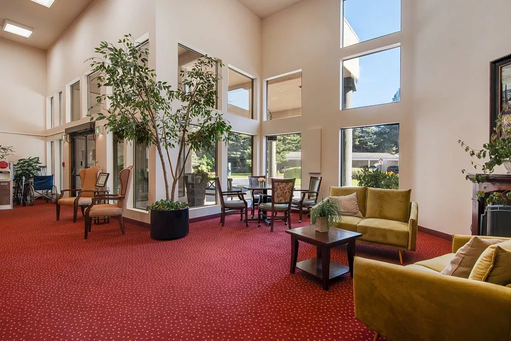 Interior view of a common area with seating and plants