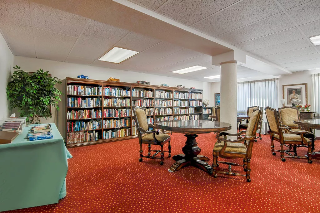Cozy common area with bookshelves and seating