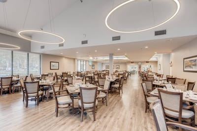 Bright dining room with tables set for meal service