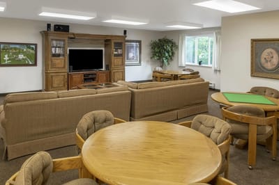 Bright common area with seating and TV