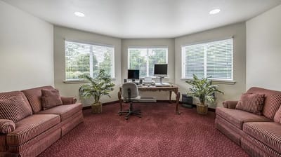 A clean and bright interior space with seating