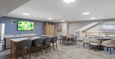 Bright, modern common area with seating and games