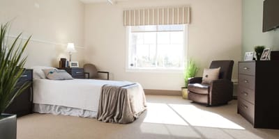 Cozy resident room with natural light and plants