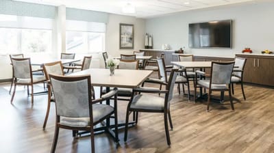 Bright common area with tables and chairs
