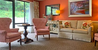 Bright common area with cozy seating and artwork