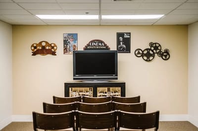 Interior view of a common area with a TV and seating