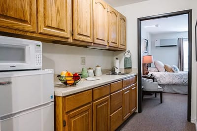 Interior view of a kitchenette and bedroom space