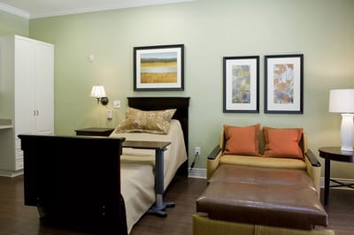 Cozy resident room with two beds and seating area