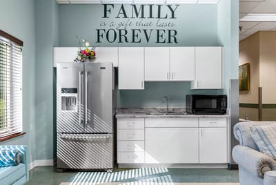Bright kitchen area with family-themed decor