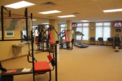 Fitness area with exercise machines and open floor space