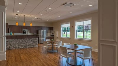 Bright common area with tables and seating