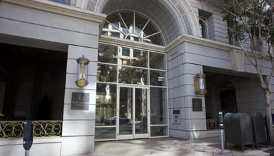 Entrance of San Francisco Towers with large glass doors