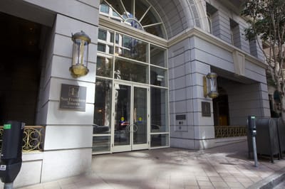 Entrance of San Francisco Towers with signage