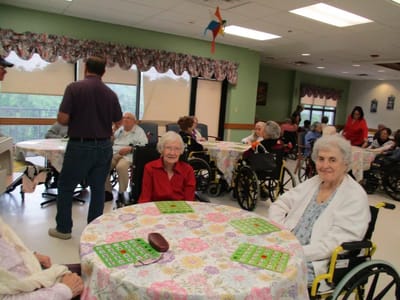 Residents enjoying a bingo game in a common area