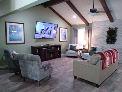 Cozy common area with comfortable seating and a television