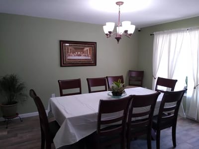 Dining area with a large table and seating.
